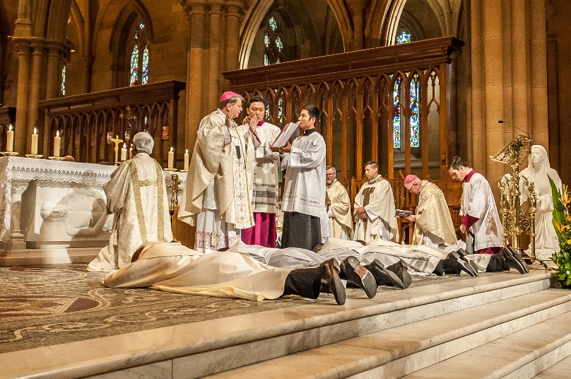 Ordinands lay prostrate during the 31 October ordination Mass at St Mary’s Cathedral. Photo: Giovanni Portelli